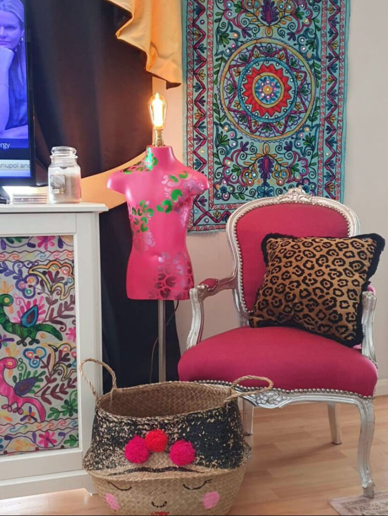 pink custom mannequin lamp in maximalist decorated living room