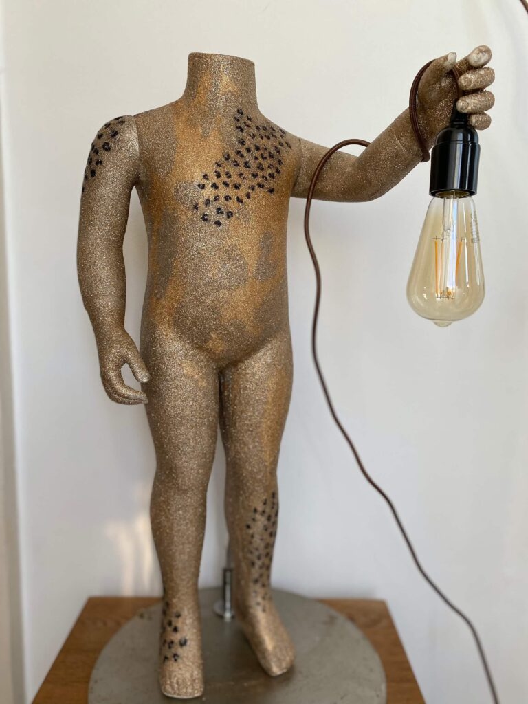 small mannequin lamp in gold with leopard print